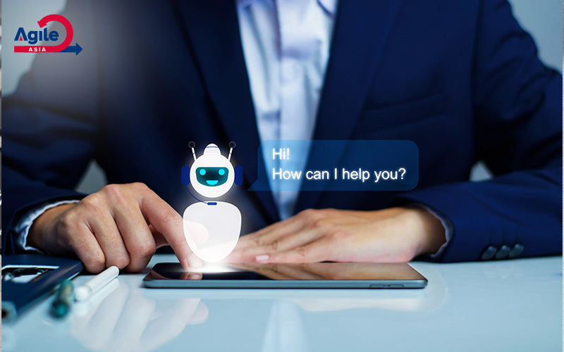 Business person interacts with a holographic chatbot.